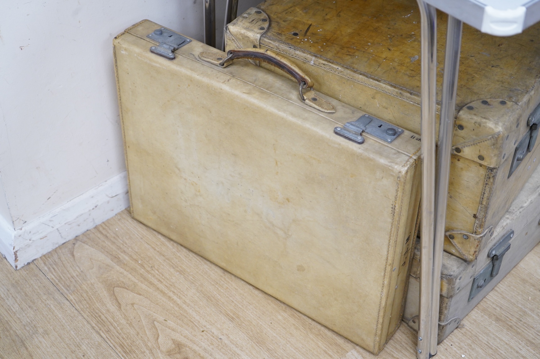 A collection of luggage comprising four vintage trunks and a hat box